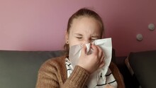 Little Child Girl Blows Her Nose. Sick Child With Napkin At Home. Allergic Kid, Flu Season Concept