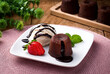 Delicious fresh fondant with hot chocolate and ice cream served on plate. petit gateau