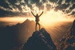 A man raising his hands for victory on the top of a mountain