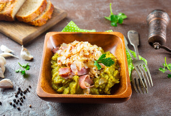 Wall Mural - mashed split peas in a bowl on a gray background