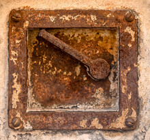 Old Rusty Door Handle On Building 