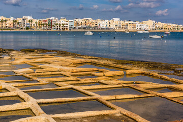 Wall Mural - Salt pans on the beach in Marsaskala , Malta