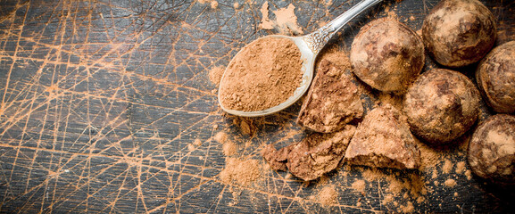 Poster - Chocolate candy truffles with cocoa powder.