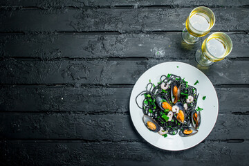 Sticker - Mediterranean food. Spaghetti with cuttlefish ink, clams and white wine.