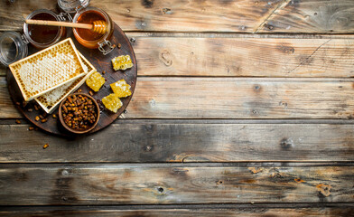 Wall Mural - Honey in glass jars and honeycombs on the Board.