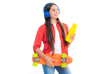 Canvas Print - Fashion teenage lifestyle, beautiful teen girl with skateboard water bottle and headphones isolated on white studio background. Portrait of happy smiling teenage child girl.