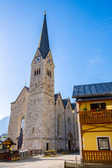 Wall Mural - Austria, Hallstatt historical village. UNESCO world heritage site, old European architecture in sunlight. Hallstatter see in background. Hallstatt is iconic world landmark.