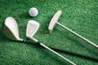 Three Golf Clubs And Ball On Astroturf Background