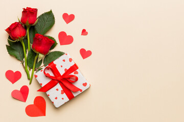 Valentine's day composition with rose flower, red heart and gift boxes on table. mother day and birthday greeting, copy space, top view