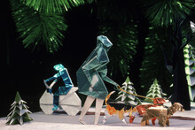 Origami Figures Placed At The Foot Of A Christmas Tree, New York, USA.