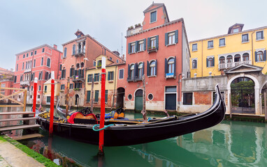 Wall Mural - Traditional colorful Venetian houses along the canal at sunset.