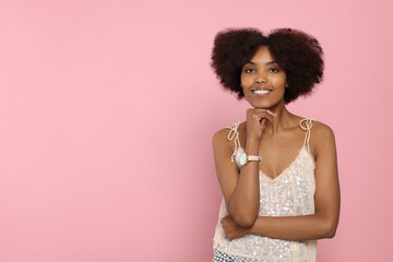 Wall Mural - Portrait of smiling African American woman on pink background. Space for text