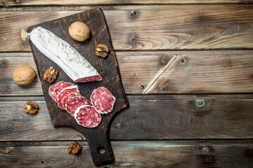 Wall Mural - Salami with walnuts.