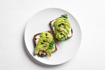 Wall Mural - Avocado toast with goat cheese, seeds