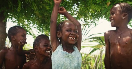 Wall Mural - A Group Of African Children, Laughing and Playing with Water in Rural Area. Black Kids Enjoying and Appreciating the Gift of Water. Concept of Human Right to get Access to Clean Water Sources