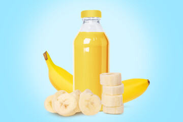 Wall Mural - Bottle of fresh banana juice, nectar. A set of bananas whole and pieces. On a blue background.