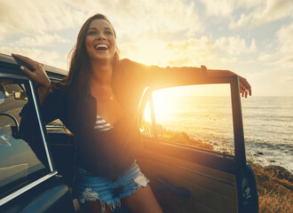 Happy, car and woman on a road trip at the beach for summer, freedom and travel in Spain. Smile, adventure and girl driving on holiday at the ocean for happiness, content and peace with transport