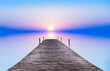 Leinwandbild Motiv paisaje con un embarcadero en el mar y un amanecer frio y azul