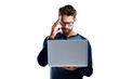 © peopleimages.com - A handsome young man using a laptop and looking stressed isolated on a PNG background.
