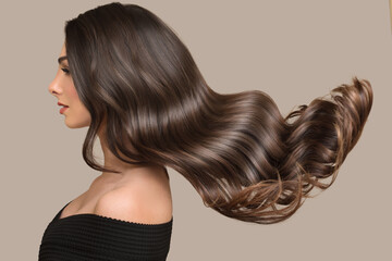 woman shiny long wavy hair up. side view. grey background