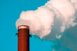 © graja - Polluting air with white smoke from industrial chimney
