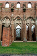 View of the ruins of Tartu Cathedral. This is the main point of interest in Tartu. Arched doors of huge gothic Dome Church in Tartu.