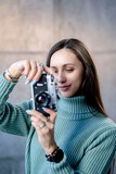 Fototapeta Paryż - Beautiful young hipster girl with old camera. 