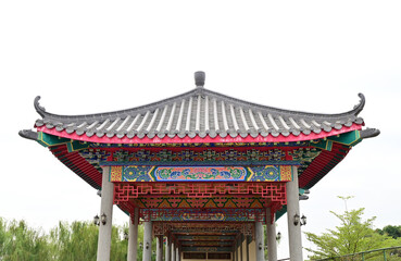 BANGKOK, THAILAND - January 16, 2023 : Part of the Roof of chinese temple in Thailand. Traditional Chinese style pattern on the roof of a temple with Blue Sky Background.