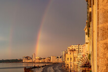 City With Rainbow After Raining