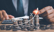 © PB Studio Photo - concept of inflation and finance Financial business, businessman's hand holding a coin, rows of coins stacked arrow showing growth percentage symbol on finance icon