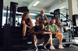 © Flamingo Images - People laughing on steps in a gym