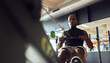 © Flamingo Images - Man using a gym rowing machine