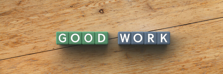 Wall Mural - 3d cubes with the words good work on a wooden background