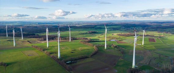 Wall Mural - Aerial view of windfarm on the fields, side view