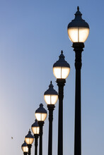 Row Of Old Street Lamps In The Evening.