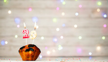 Happy Birthday Background With Muffin And Number Of Candles On Light Bulbs Bokeh Background. Greeting Card Happy Birthday Copy Space With Number  29