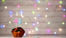 Happy Birthday Background With Muffin And Number Of Candles On Light Bulbs Bokeh Background. Greeting Card Happy Birthday Copy Space With Number  41