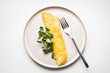 French omelette with salad. Top view on healthy breakfast.