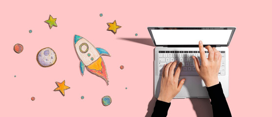 Wall Mural - Space exploration theme with rocket and laptop