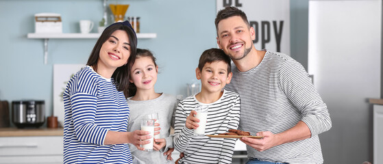 Wall Mural - Happy family drinking milk during breakfast at home