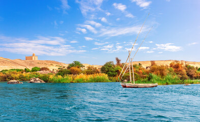 Wall Mural - The Nile view with the old sailboats in the Aswan desert, Egypt