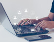 © THAWEERAT - Businessman sending email by a laptop computer with email and people icons. Online people network. Using the internet for communication.