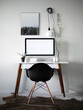 © Cavan Images - Minimal black and white office desk with plants and skulls decor