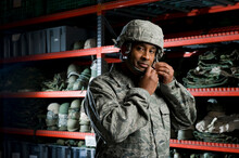 A U.S. Air Force Member Tries On A Helmet During The Deployment Issue Line.