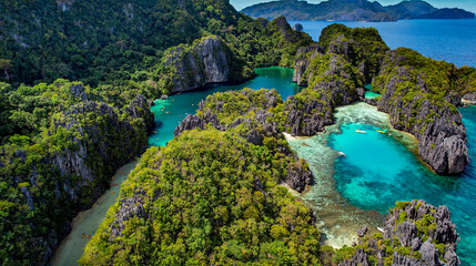 The Big Lagoon In El Nido, Palawan, Philippines. Kayaking In Shallow Crystal Clear Water, Turquoise Colored Reef, Bright Green Tree Covering Cliffs. Best vacation