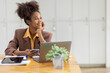 © David - Thinking about how to take the business to technological heights. Cropped shot of an attractive young african american businesswoman working in her office, looking away.