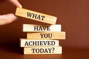 Poster - Wooden blocks with words 'What have you achieved today?'.