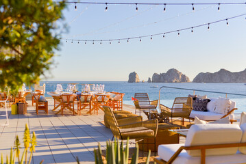 Tables set up for an event on the beach.