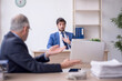 © Elnur - Two male colleagues working in the office