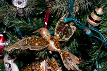Christmas Tree Decoration Closeup Focus On Bird With Spread Wings
